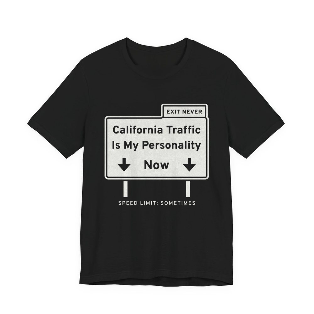 Black t-shirt printed in off-white ink with a freeway sign reading “California Traffic Is My Personality Now” with down arrows, an “Exit Never” tab and “Speed limit: sometimes”