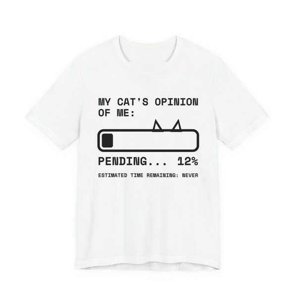 White t-shirt printed in dark ink with “My Cat's Opinion of Me:” above a loading bar with cat ears, stuck at “Pending... 12%”, with “Estimated time remaining: never”