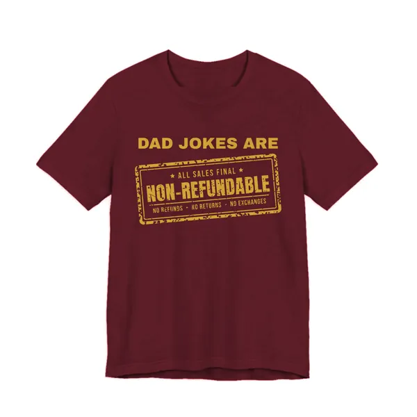 Preview, not for sale yet: Dad Jokes Are Non-Refundable tee printed in gold ink on a maroon shirt
