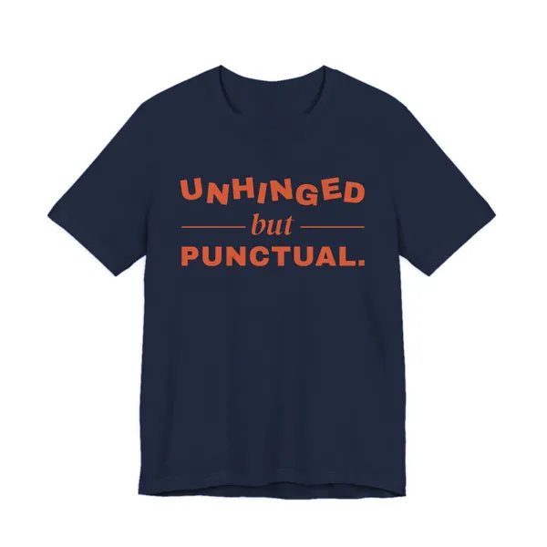 Preview, not for sale yet: Unhinged but Punctual tee printed in orange ink on a navy shirt