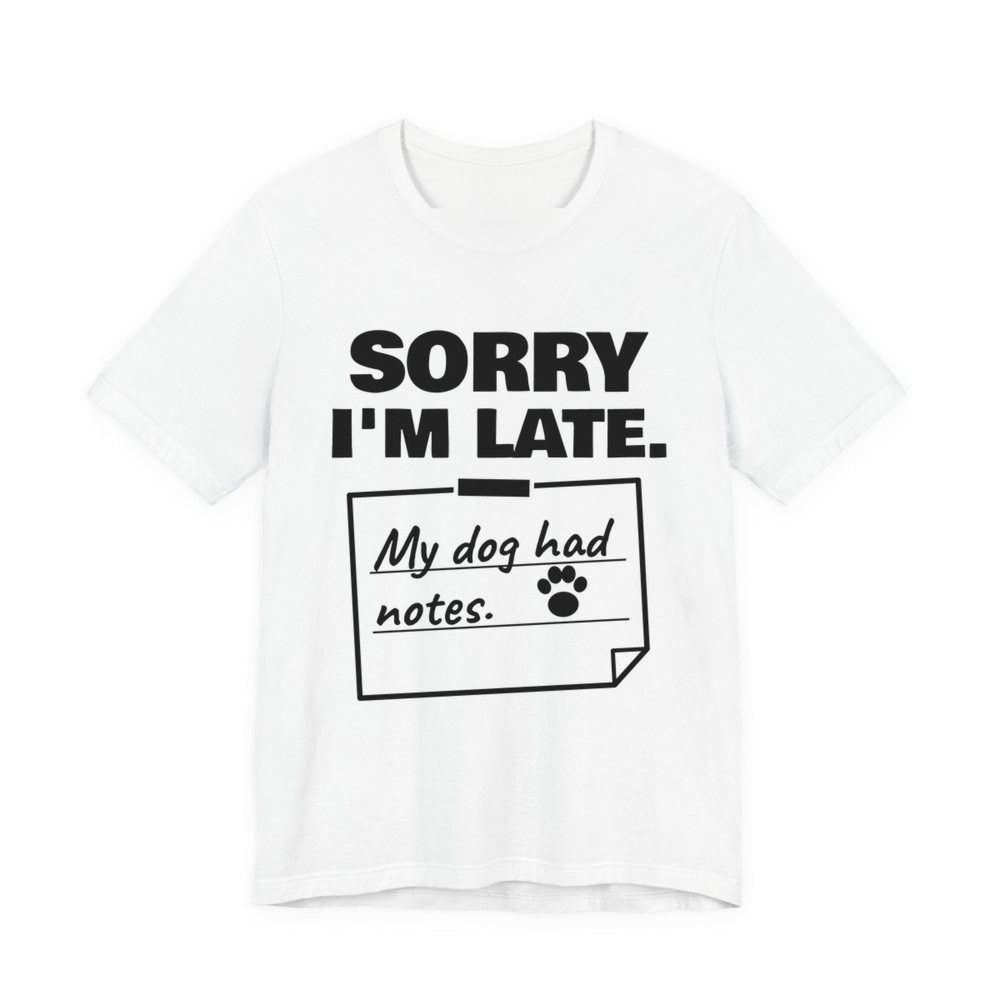 White t-shirt printed in dark ink with “Sorry I'm Late.” above a taped-up sticky note reading “My dog had notes.” with a paw print