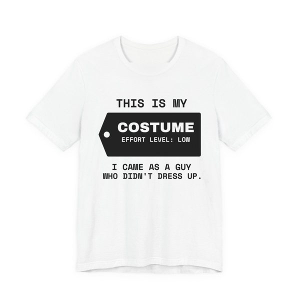 White t-shirt printed in dark ink with “This Is My” above a hang tag reading “Costume, effort level: low”, with “I came as a guy who didn't dress up.”