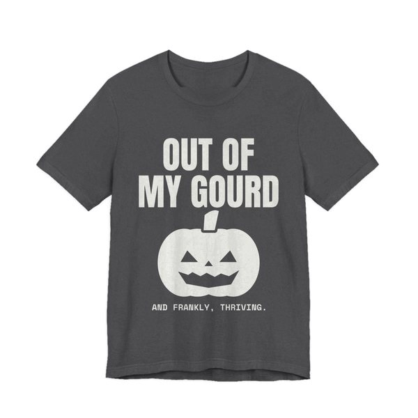 Dark Grey Heather t-shirt printed in off-white ink with “Out of My Gourd” above a grinning jack-o'-lantern, with “And frankly, thriving.”