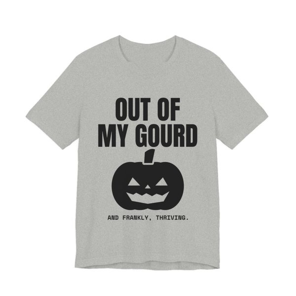 Athletic Heather t-shirt printed in dark ink with “Out of My Gourd” above a grinning jack-o'-lantern, with “And frankly, thriving.”