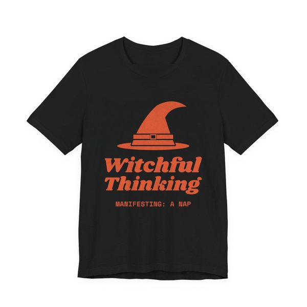 Black t-shirt printed in orange ink with a witch hat above “Witchful Thinking” in script, with “Manifesting: a nap”