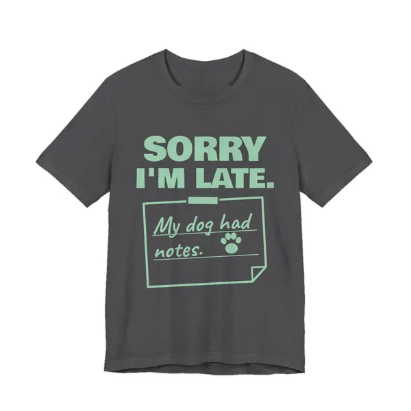 Sorry I'm Late. My Dog Had Notes. tee printed in mint green ink on a dark grey heather shirt