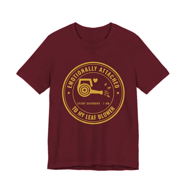 Emotionally Attached to My Leaf Blower tee printed in gold ink on a maroon shirt