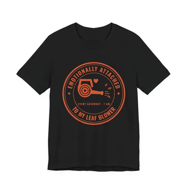 Emotionally Attached to My Leaf Blower tee printed in orange ink on a black shirt