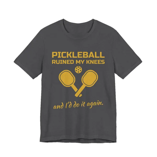 Pickleball Ruined My Knees and I'd Do It Again tee printed in gold ink on a dark grey heather shirt