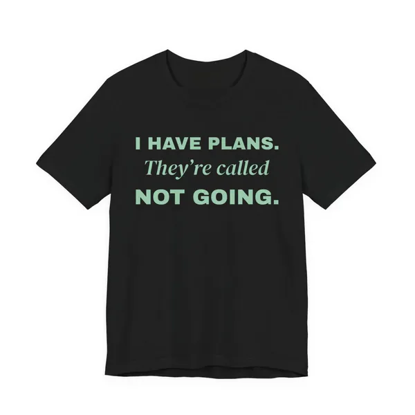 I Have Plans. They're Called Not Going. tee printed in mint green ink on a black shirt