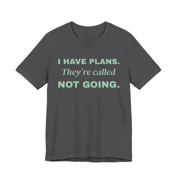 I Have Plans. They're Called Not Going. tee printed in mint green ink on a dark grey heather shirt