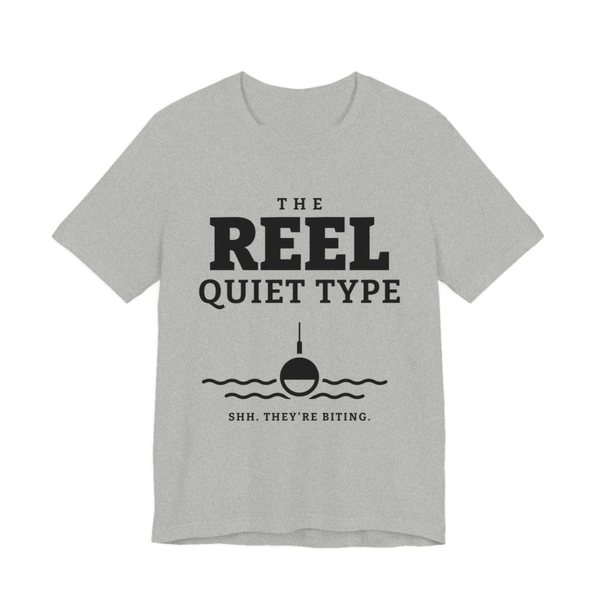 Athletic Heather t-shirt printed in dark ink with “The Reel Quiet Type” above a bobber floating on calm water, with “Shh. They're biting.”