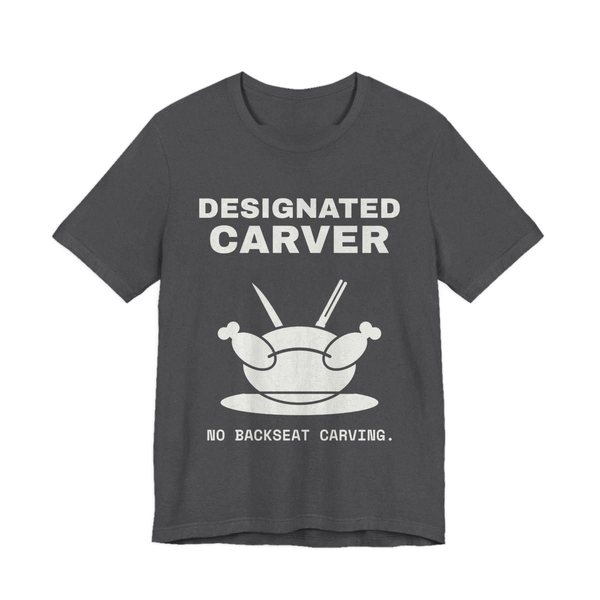 Dark Grey Heather t-shirt printed in off-white ink with a crossed carving knife and fork and the words “Designated Carver”