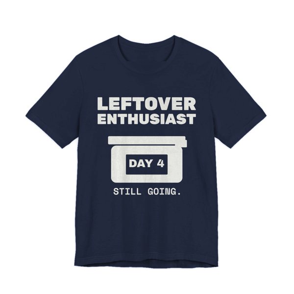 Navy t-shirt printed in off-white ink with a takeout-style leftovers container and the words “Leftover Enthusiast”