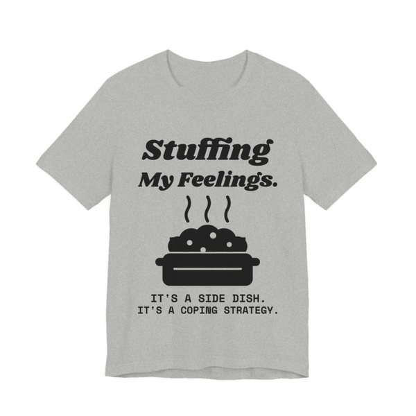 Athletic Heather t-shirt printed in dark ink with the words “Stuffing My Feelings.”
